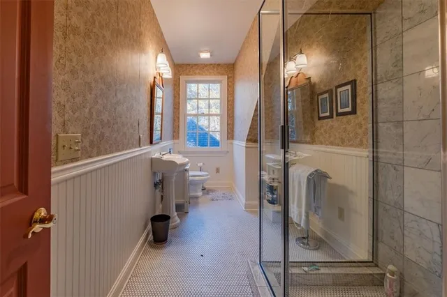 a bathroom with a bathtub and a shower
