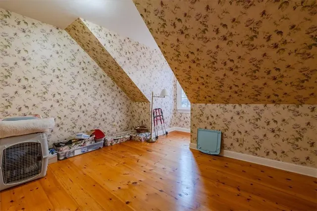 a bedroom with a bed furniture and a window