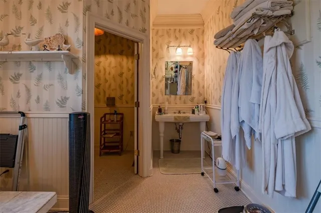 a living room with fireplace furniture and a wooden floor