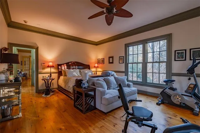 a kitchen with sink a window and chairs
