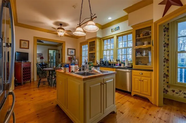 a view of a livingroom with furniture and bookshelf