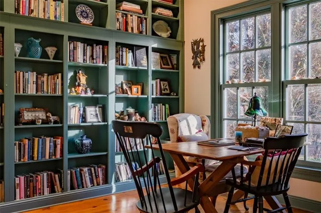 a view of a yard with plants and trees
