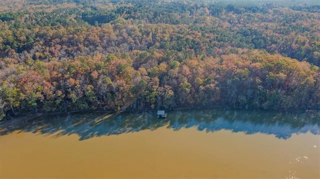 a view of table and chairs under an umbrella