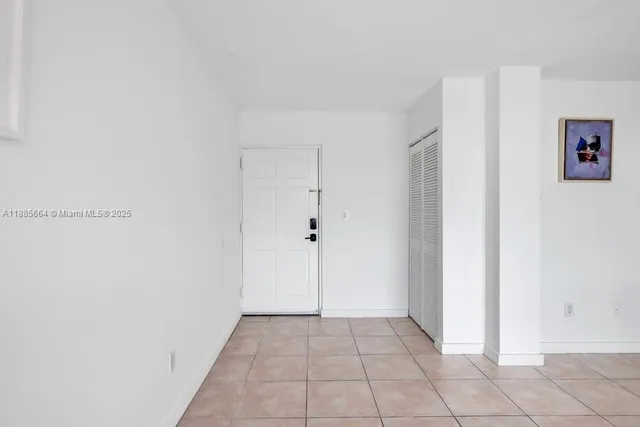 a view of kitchen with furniture and appliances