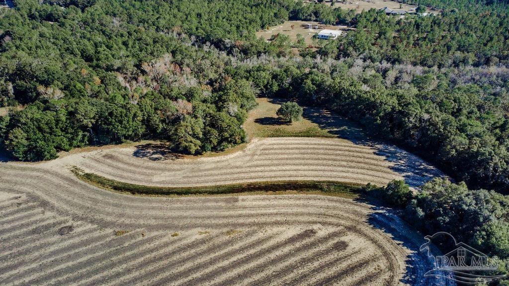 2 A Segrest Road Pace, FL 32571 - Photo 6 of 12 a view of a house with a yard