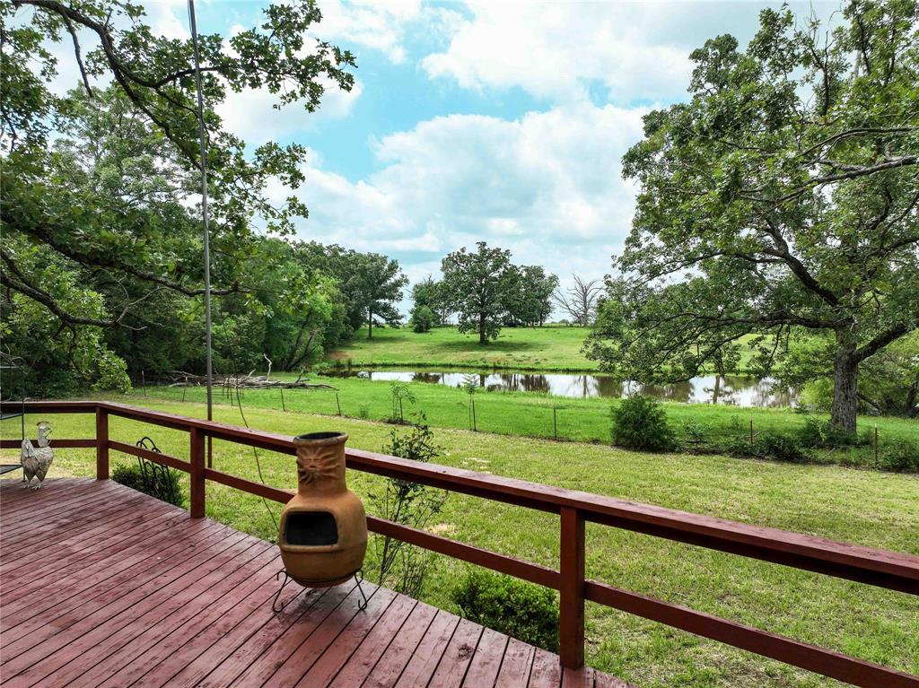3389 Pvt Road Van, TX 75790 - Photo 26 of 31 a view of a deck with wooden floor and fence