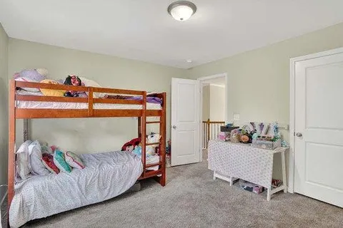 a bedroom with furniture and a couch