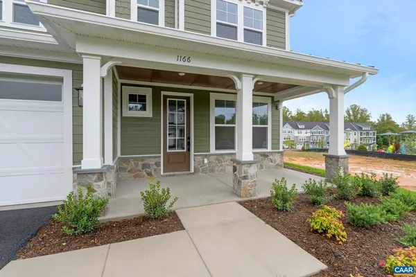 a front view of a house with a porch
