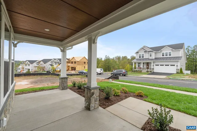 a front view of a house with a big yard