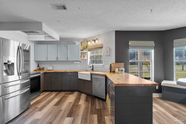 a kitchen with a sink and a stove