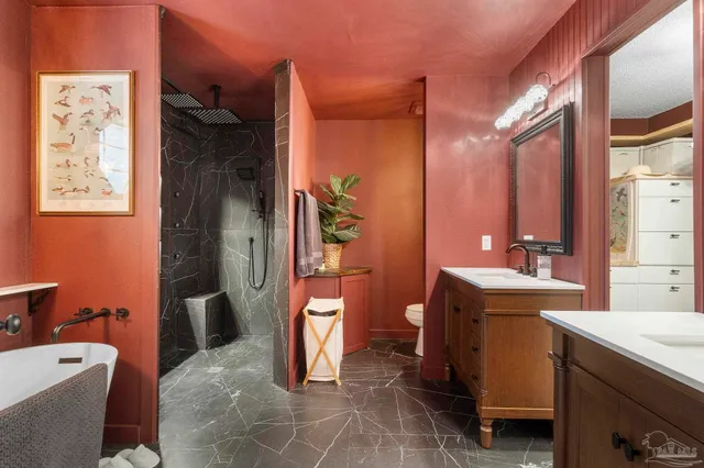 a bathroom with a double vanity sink and mirror