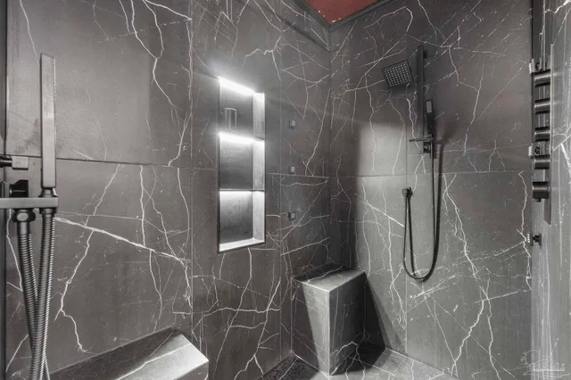 a view of a house with backyard and trees