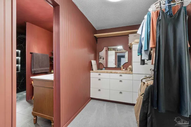 a view of a house with swimming pool and sitting area