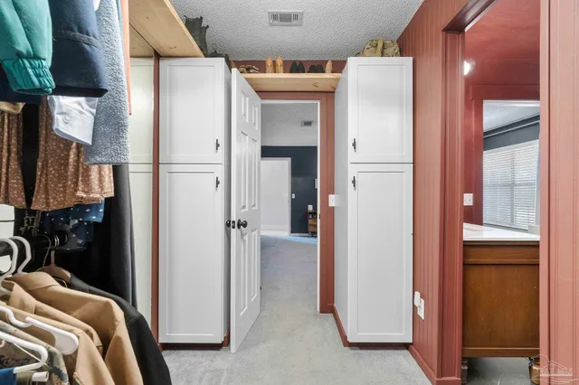 a house view with a sitting space and garden