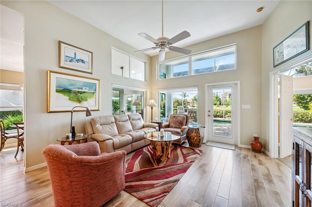 116 Napa Ridge Way Naples, FL 34119 - Photo 3 of 28 a living room with furniture and a large window