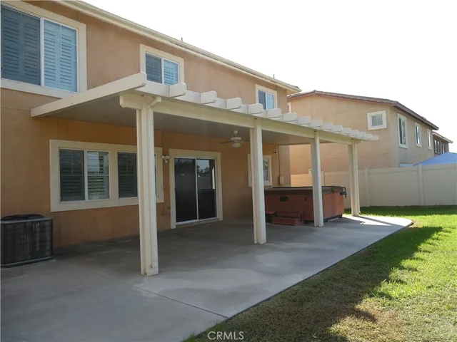 a front view of a house with a big yard and garage
