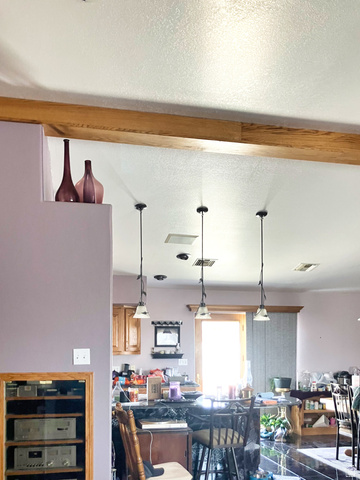 1060 Freedom Way Kanab, UT 84741 - Photo 6 of 12 Dining space with a textured ceiling, beamed ceiling, and wine cooler