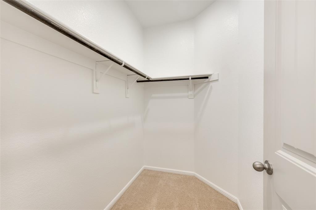 857 Watson Way Crowley, TX 76036 - Photo 23 of 25 Walk-in closet featuring light-colored carpeting and white walls