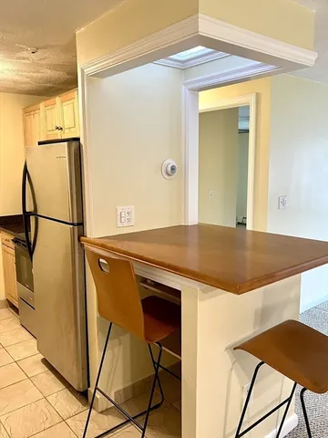 a kitchen with a table and chairs