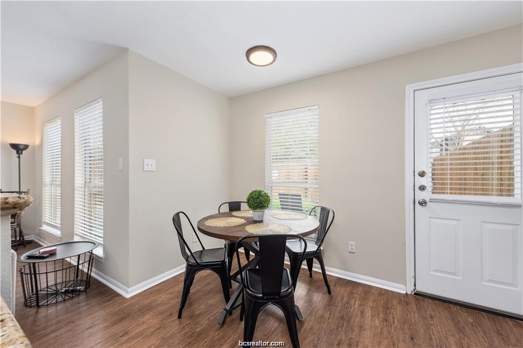 1209 Oney Hervey Drive College Station, TX 77840 - Photo 11 of 22 a view of a dining room with furniture and wooden floor