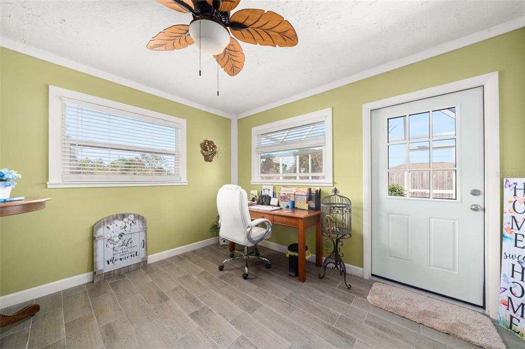 443 Foxdale Road Lake Placid, FL 33852 - Photo 13 of 31 a workspace with wooden floor and a window