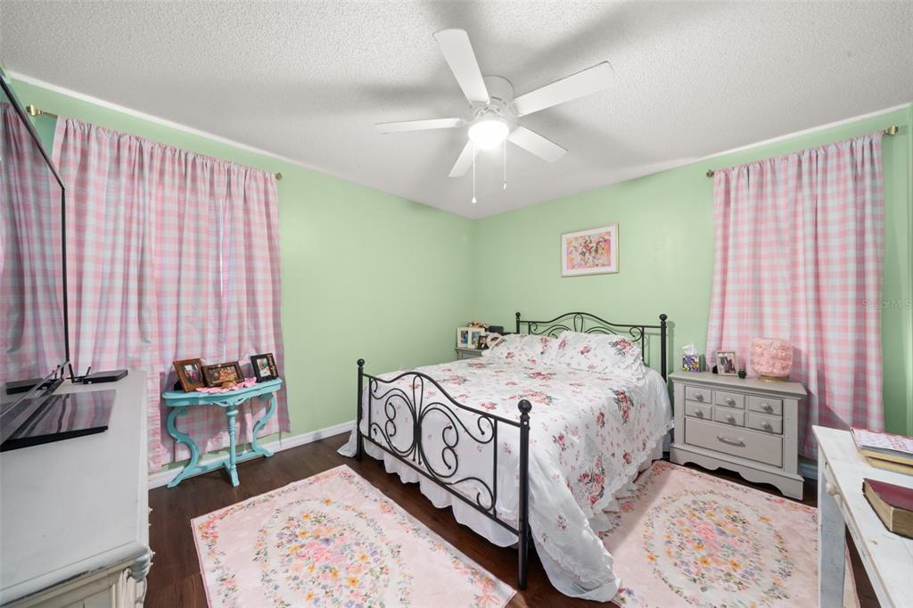 443 Foxdale Road Lake Placid, FL 33852 - Photo 20 of 31 a bedroom with a bed a dresser and a window