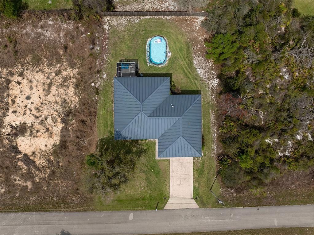 443 Foxdale Road Lake Placid, FL 33852 - Photo 26 of 31 a aerial view of a house with a yard and large trees