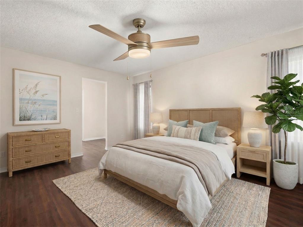 443 Foxdale Road Lake Placid, FL 33852 - Photo 29 of 31 a bedroom with a bed and a chandelier