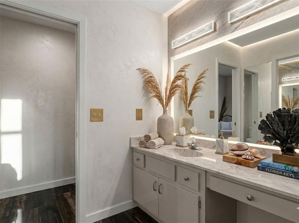 443 Foxdale Road Lake Placid, FL 33852 - Photo 30 of 31 a bathroom with a granite countertop sink a mirror and a window