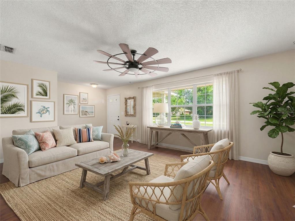 443 Foxdale Road Lake Placid, FL 33852 - Photo 31 of 31 a living room with furniture and a large window