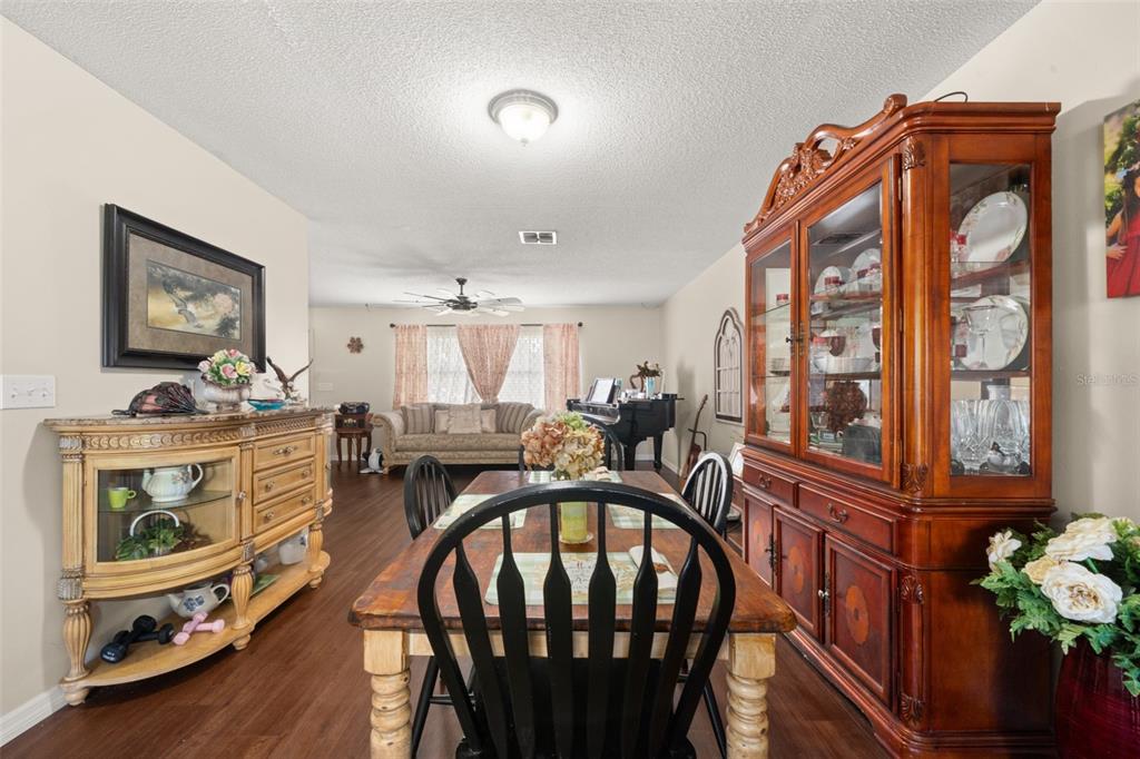 443 Foxdale Road Lake Placid, FL 33852 - Photo 6 of 31 a view of a dining room with furniture window and wooden floor
