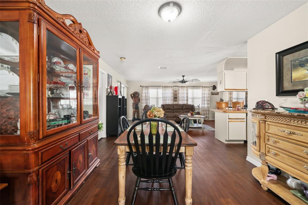 443 Foxdale Road Lake Placid, FL 33852 - Photo 7 of 31 a view of a dining room with furniture window and wooden floor