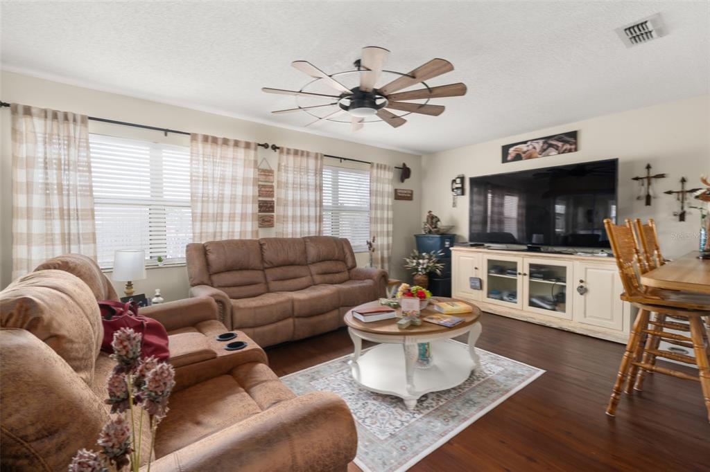 443 Foxdale Road Lake Placid, FL 33852 - Photo 8 of 31 a living room with furniture and a flat screen tv