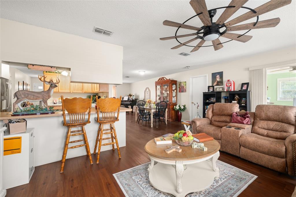443 Foxdale Road Lake Placid, FL 33852 - Photo 9 of 31 a living room with furniture and wooden floor