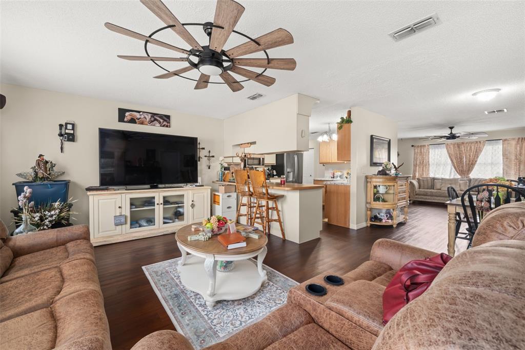 443 Foxdale Road Lake Placid, FL 33852 - Photo 10 of 31 a living room with furniture and a flat screen tv
