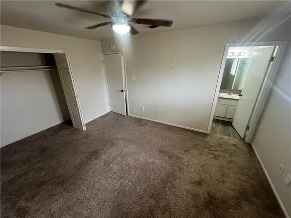 an empty room with windows and entrance