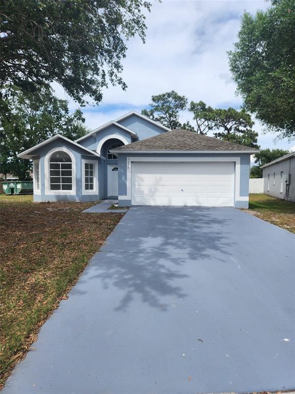 3446 Cypress Point Circle St. Cloud, FL 34772 - Photo 1 of 1 front view of a house with a yard