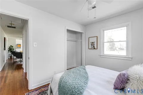 a bedroom with bed and a window