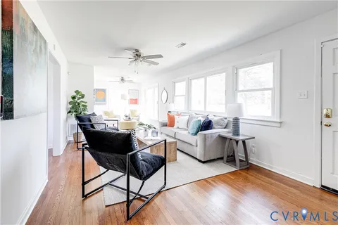 a living room with furniture and a window