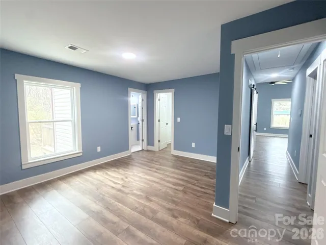 a view of a livingroom with wooden floor