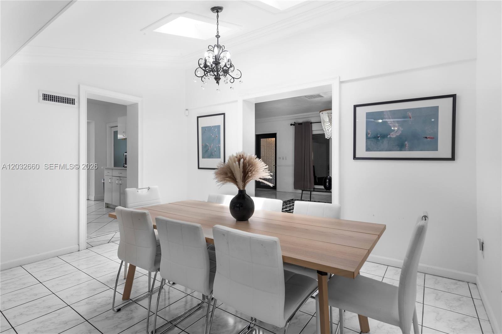 520 Southwest 22nd Road Miami, FL 33129 - Photo 33 of 76 a dining room with furniture and chandelier