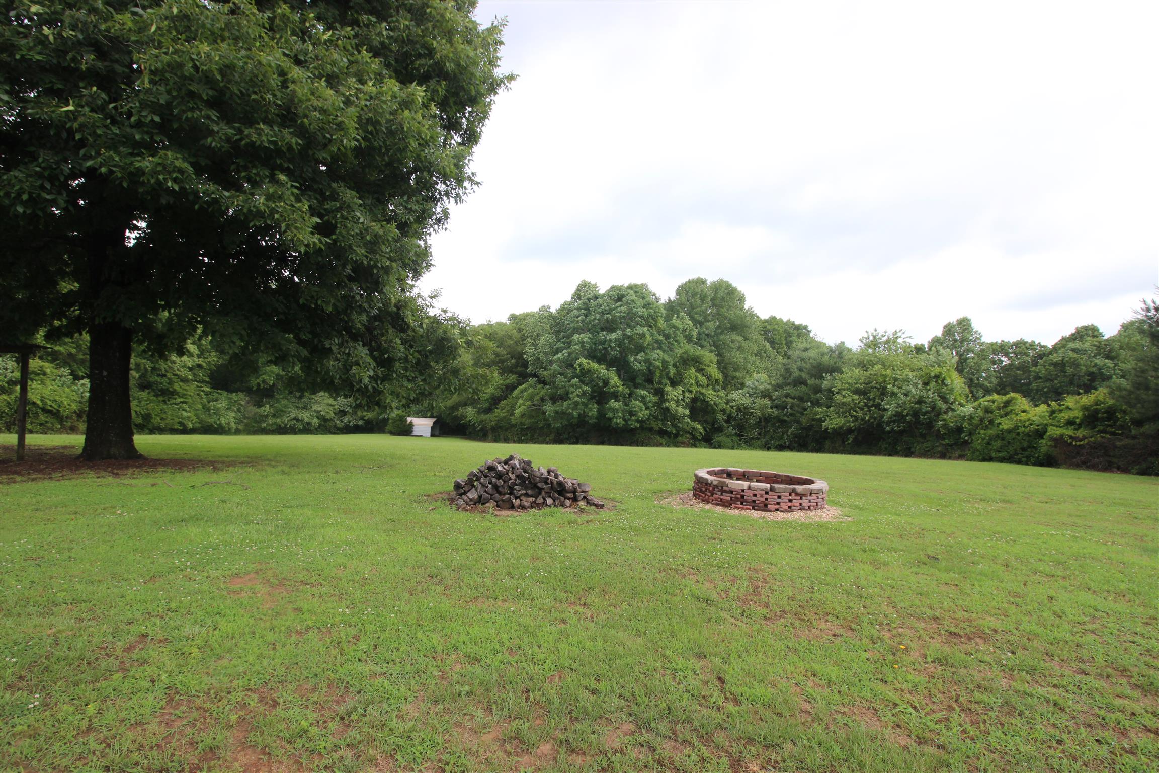 1074 Yellow Creek Road Dickson, TN 37055 - Photo 6 of 24 Firepit and det carport for those lawn toys