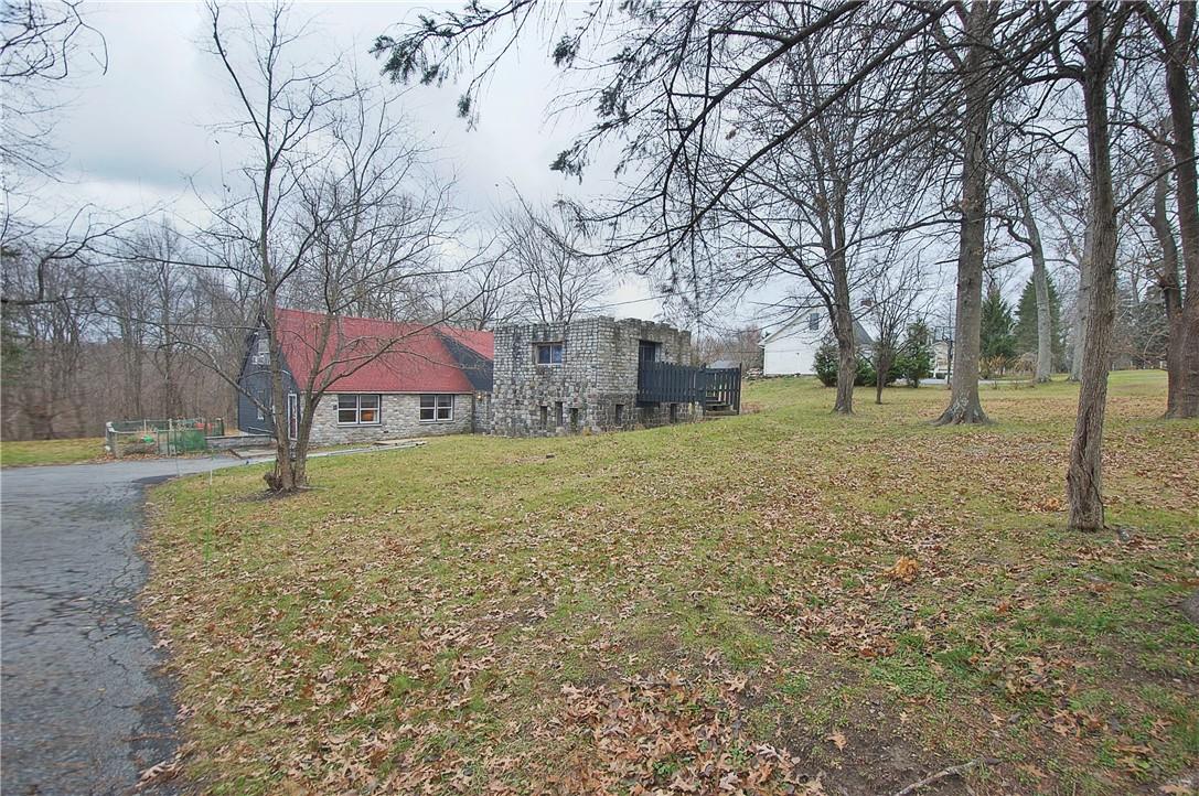 478 Ridge Road Campbell Hall, NY 10916 - Photo 1 of 1 Stone features upon a wooded backdrop make this home a country charm! View of home and multipurpose room known as "The Castle" with exterior entrance.