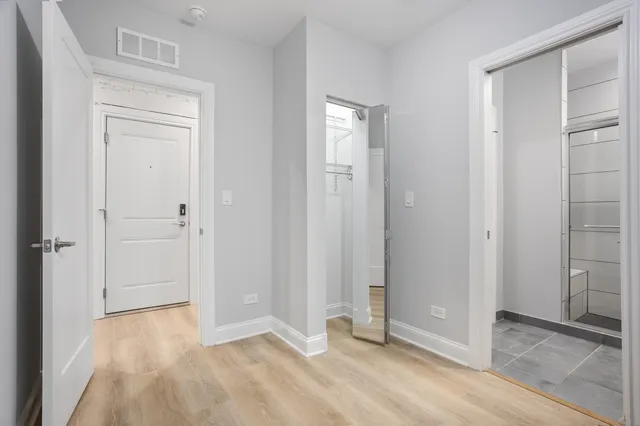 wooden floor and closet area in a room