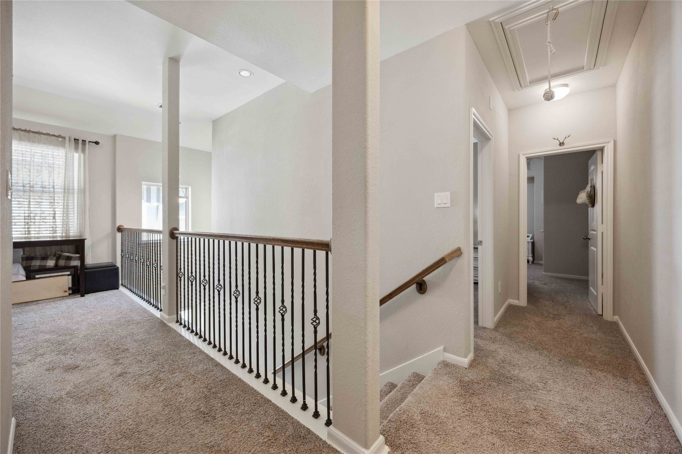 323 Biltmore Loop Montgomery, TX 77316 - Photo 15 of 27 Bright upstairs landing with neutral finishes.