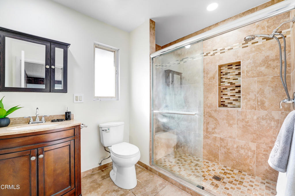 907 North Stoneman Avenue Alhambra, CA 91801 - Photo 12 of 19 a bathroom with a sink toilet and shower