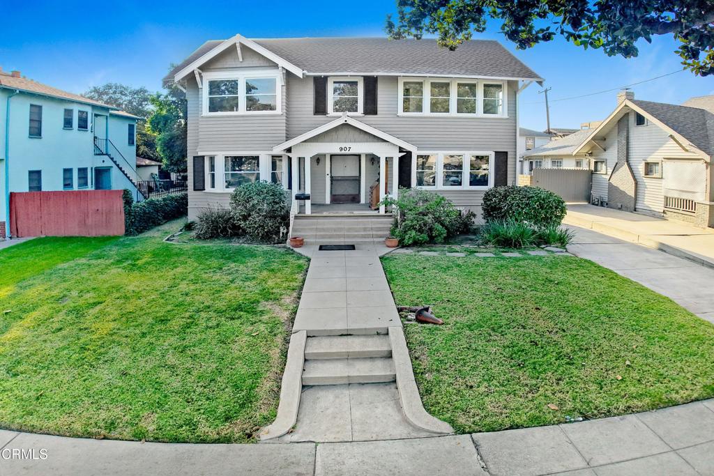 907 North Stoneman Avenue Alhambra, CA 91801 - Photo 16 of 19 a front view of a house with a yard