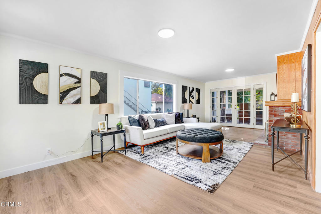907 North Stoneman Avenue Alhambra, CA 91801 - Photo 2 of 19 a living room with furniture and a large window