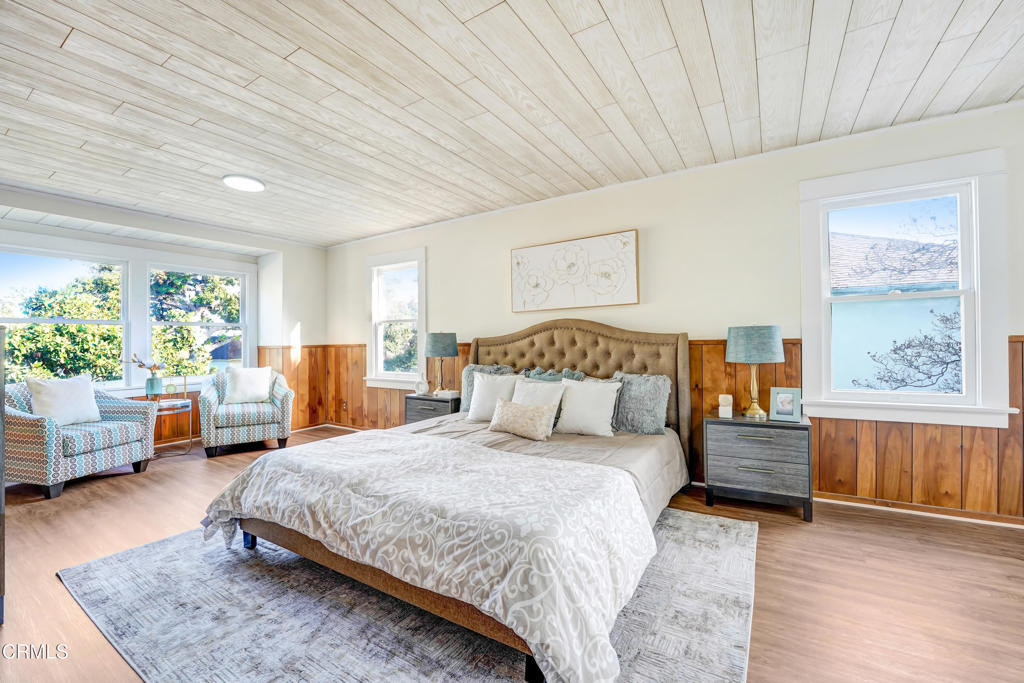 907 North Stoneman Avenue Alhambra, CA 91801 - Photo 5 of 19 a spacious bedroom with a bed and a couch