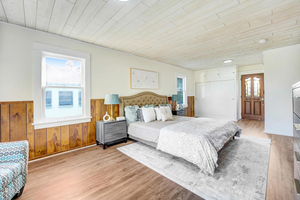 907 North Stoneman Avenue Alhambra, CA 91801 - Photo 8 of 19 a spacious bedroom with a large bed and dresser